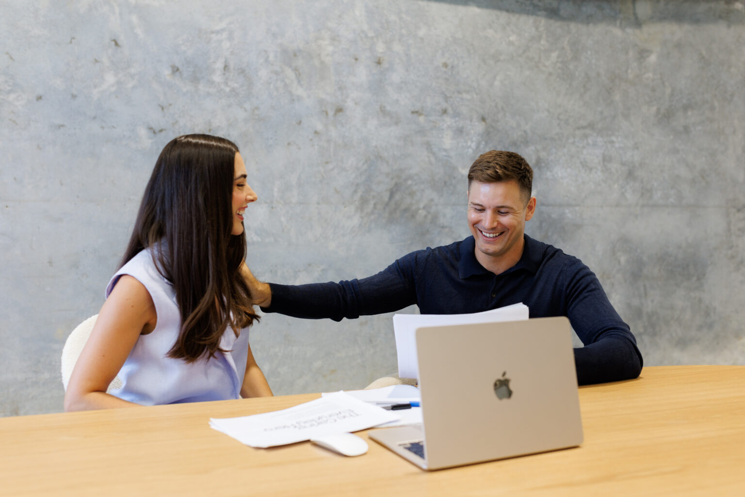 Josh Birch meeting with a client at a table