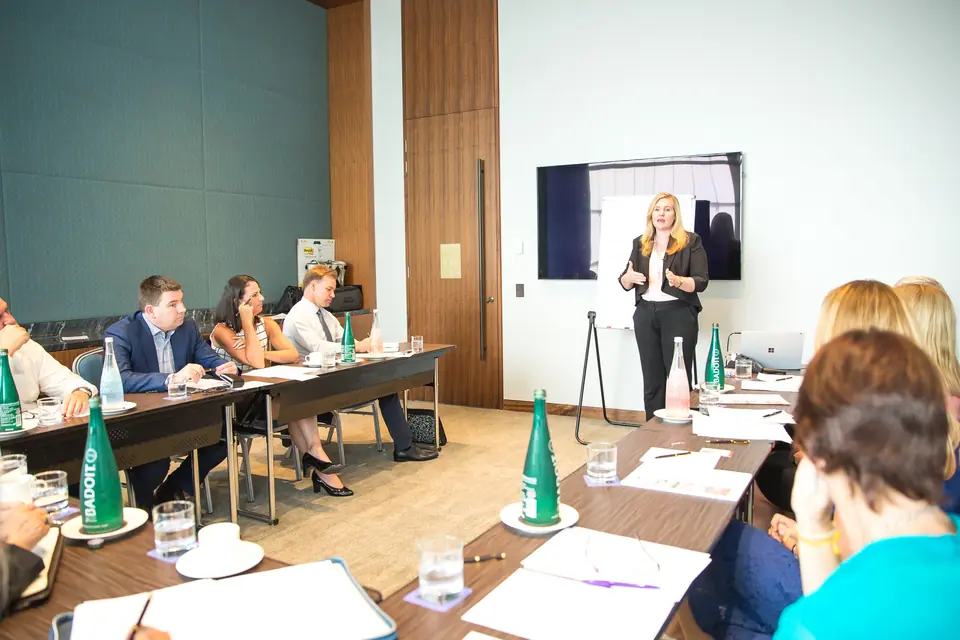A WeTrain workshop, with the presenter at the front of a boardroom